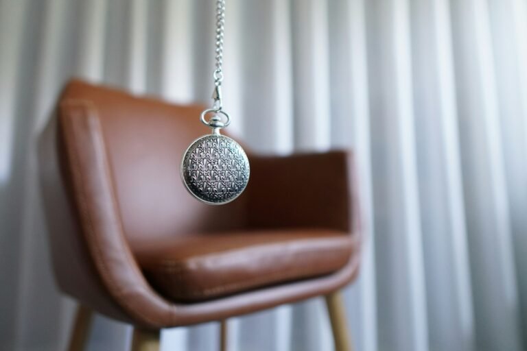 a chair with pocket watch dangling in front of it suggesting hypnosis