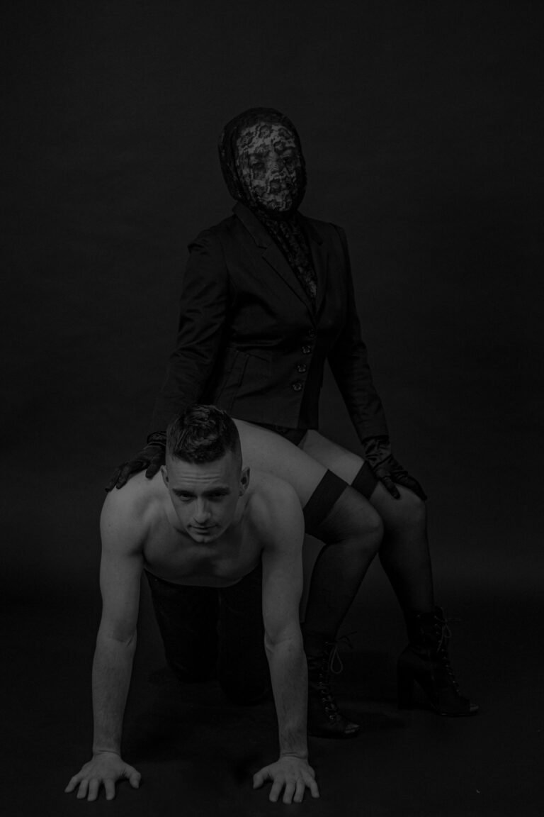 Dominant woman sitting on a submissive male